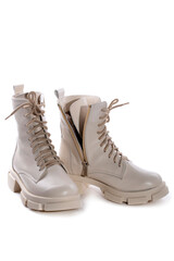 Female winter boots on high soles on a white background