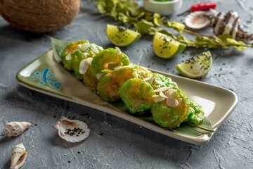 Tiger prawns with Wasabi sauce and almond feathers. Singapore fast food.