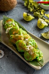 Tiger prawns with Wasabi sauce and almond feathers. Singapore fast food.