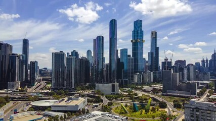 Aerial: Melbourne City Skyscrapers on a Perfect Sunny Day Time Lapse with Roads and Traffic an