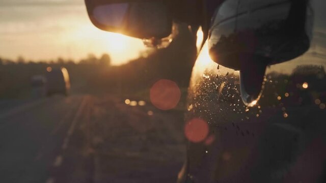 Aar is parked in the side of the road in the summer morning. Light backdrop. Travel concept. Summer road trip. Nature concept.