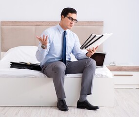 Businessman working in hotel room