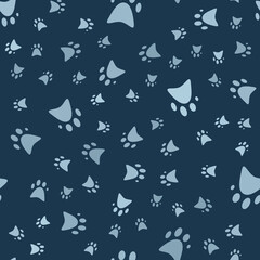 Seamless pattern with paws. Abstract pattern with blue paws. Random, chaotic background with cute paws.