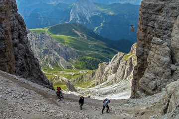 Hikers in Focella Pordoi on Sella Group Dolomite, Trentino, Italy