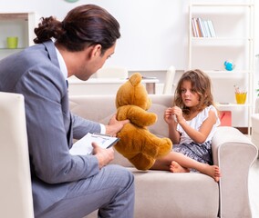 Child psychologist attending small girl