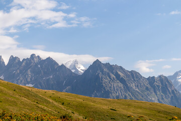 Amazing view from the Tskahazagari peak on the sharp Svaneti mountain peaks near Mestia in the Greater Caucasus Mountain Range, Upper Svaneti, Country of Georgia.Hiking trail to the Koruldi Lakes.