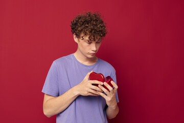 cute guy in purple t-shirt heart-shaped gift holiday