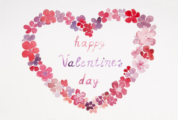 Heart of flowers with watercolors on a white background with the inscription: Happy Valentine's Day.