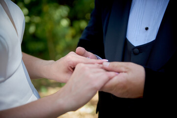 bride and groom on a walk. wedding day. bride and groom. love between people. newlyweds. wedding walk. newlyweds walk gently touching each other.