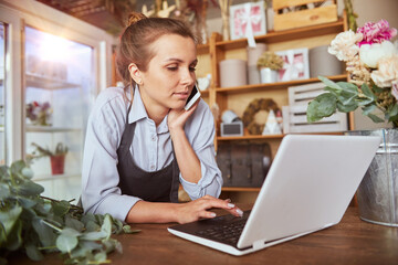 Self employed florist working at flower shop