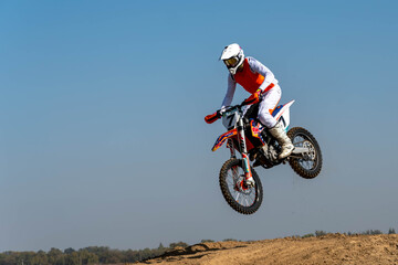 Fototapeta na wymiar jumping on a motorcycle. motocross. motorcycle racing. bikers on the track