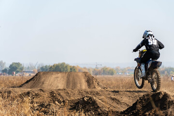 jumping on a motorcycle. motocross. motorcycle racing. bikers on the track