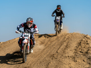 Obraz premium jumping on a motorcycle. motocross. motorcycle racing. bikers on the track