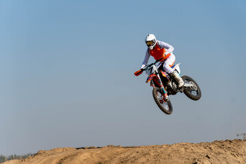 jumping on a motorcycle. motocross. motorcycle racing. bikers on the track