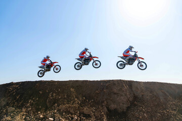 jumping on a motorcycle. motocross. motorcycle racing. bikers on the track