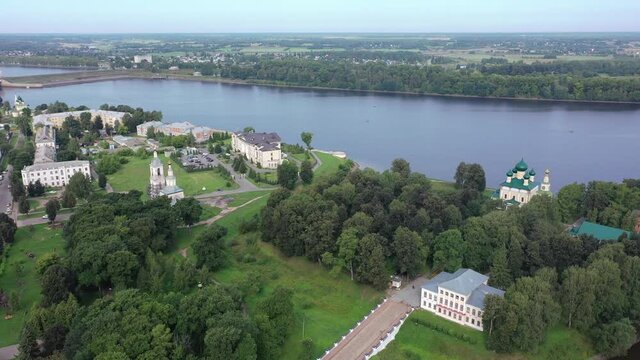 Summer aerial view of modern Uglich cityscape overlooking architectural complex of Kremlin with Transfiguration Cathedral and Church of Dimitry Tsarevich on bank of Volga, Russia