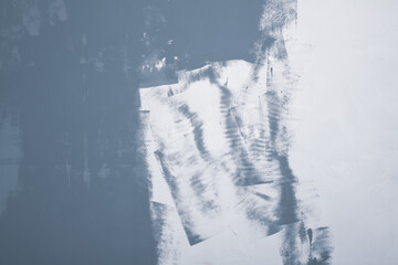 A gray-painted wall in the house, the paint dries on a white wall