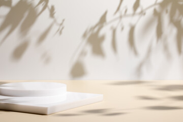 Abstract minimal nature scene - empty stage and white circle podium on beige background and soft shadows of tree leaves. Pedestal for cosmetic product and packaging mockups display presentation