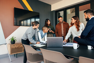 Diverse businesspeople discussing some reports in a boardroom