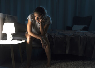 Exhausted woman suffering from insomnia - obrazy, fototapety, plakaty