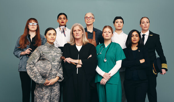 Confident female workers standing together in a studio
