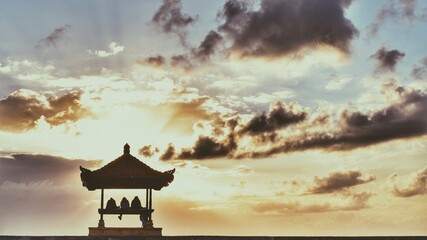 sunset in the temple, sanur beach, bali