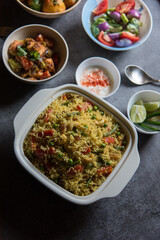Homemade Indian lunch item pulao or vegetable fried rice or biryani served in a bowl. Top view.