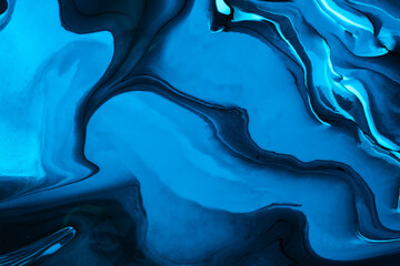 Abstract fluid art background navy blue and black colors. Liquid marble. Acrylic painting with...