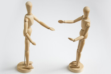 Talking wooden dolls. Isolated on white background.