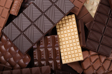 Bitter and milk chocolate background, sweet cocoa dessert.