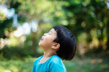 The boy enjoyed being in the garden, learning outdoors, closing his eyes and raising his head for a...