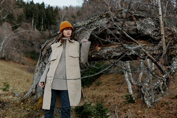 portrait of a woman standing near a tree autumn style fresh air Autumn walk