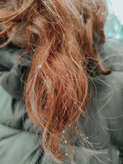 snowflake on red curly hair