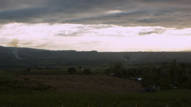 Evening comes as we see some soil being burned by plantation workers.