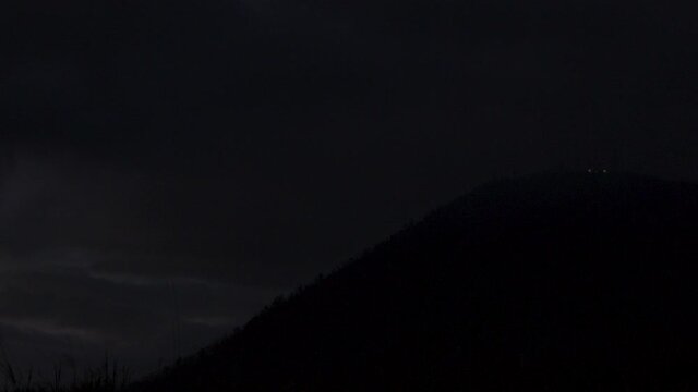 Mountain is quickly consumed by darkness.