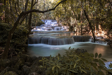 Long exposure exotic  beautiful tropical deep rainforest waterfall   Fresh turquoise waterfalls in deep forest of Huay Mae Khamin waterfall in the national park Beautiful landscape waterfalls 