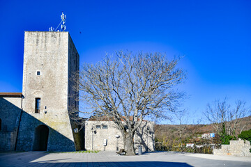 A square overlooking a medieval tower from the Norman era in Casalbore, an Italian village in the...