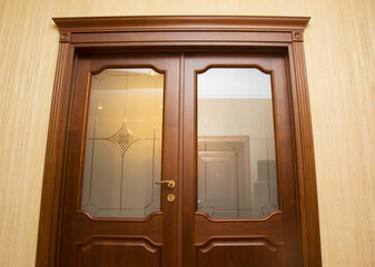Close up of closed wooden door in the empty room