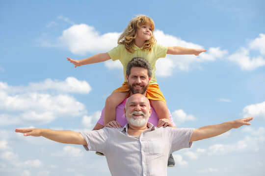 Portrait of parent grandfather, son and grandson raising hands or open arms flying. Parenting parenthood concept.