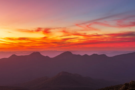 Australia, Victoria, Silhouettes of mountains seen from Mount William at moody sunset