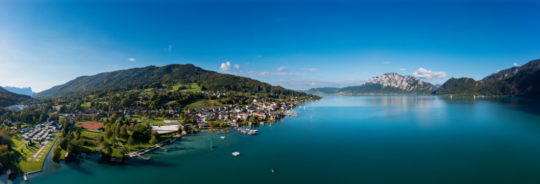 Austria, Upper Austria, Unterach am Attersee, Drone panorama of Lake Atter and lakeshore village