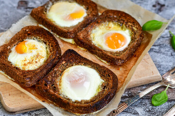 Fried egg on Wholegrain low carb  Toast with cherry tomatoes. Ketogenic  diet healty  food.Traditional French Dish Croque-Madame 