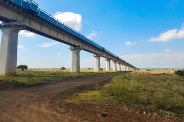 Fototapeta premium Scenic view of the Nairobi Mombasa Standard Gauge Railway line seen from Nairobi National Park, Kenya