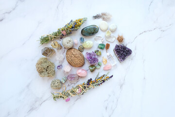 Gemstones, floral bundles for cleansing, nature magic things on marble table. healing minerals for...