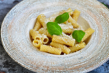  Italian home made  rigatoni   pasta  with  tuna  fish, parmesan cheese and black pepper .