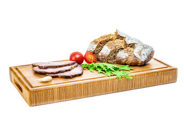 Delicious appetizers for wine or a snack - prosciutto, figs, bread, cheese on a rustic wooden...