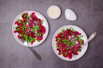 Beetroot pasta with green peas