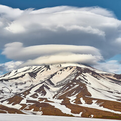 Volcano peak with beautiful clouds. Kamchatka, Russia. Travel and tourism in the mountains