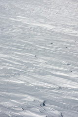 Winter textures. Details of the shapes that winter creates from snow on top of the mountains. Abstract texture background.