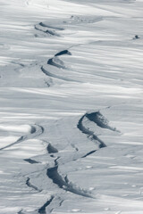 Obraz premium Winter textures. Details of the shapes that winter creates from snow on top of the mountains. Abstract texture background.